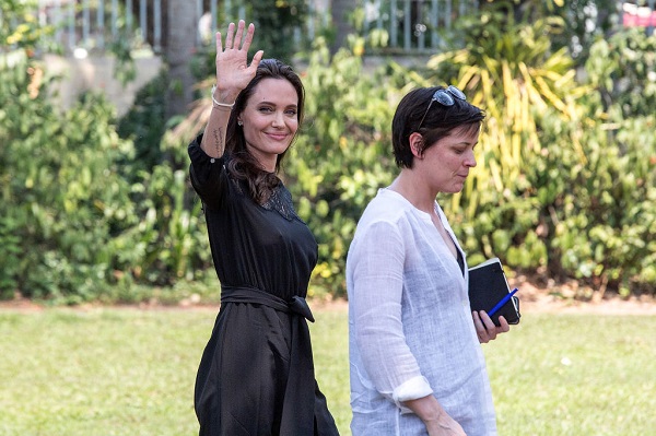 SIEM REAP, CAMBODIA - FEBRUARY 18:  Angelina Jolie greets members of the press while leaving a press conference ahead of the premiere of her new film "First They Killed My Father" set up at the Raffles Grand Hotel D'Angkor on February 18, 2017 in Siem Reap, Cambodia. Angelina Jolie is in Siem Reap for the world premiere of her new movie, "First They Killed my Father," a Netflix-produced adaption of the autobiography by the same name penned by Loung Ung, who lived through the Khmer Rouge regime as a young child. The film will be screened Saturday night in the Angkor Wat temple complex, and released later this year on Netflix. (Photo by Omar Havana/Getty Images)