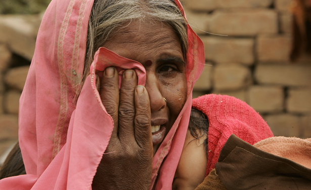 **ADVANCE FOR MONDAY, APRIL 14** Shanti Devi cries holding Shezal Tomar, at her home in Singhpura, India, Tuesday, Jan. 29, 2008. She has given birth to eight daughters apart from three abortions. Although India is changing dramatically the obsession for a male child has seen gender gap widening by the day with only 927 girls being born for every 1000 males nationwide according to the 2001 census from 962 girls to a 1000 boys in 1981. (AP Photo/Saurabh Das)