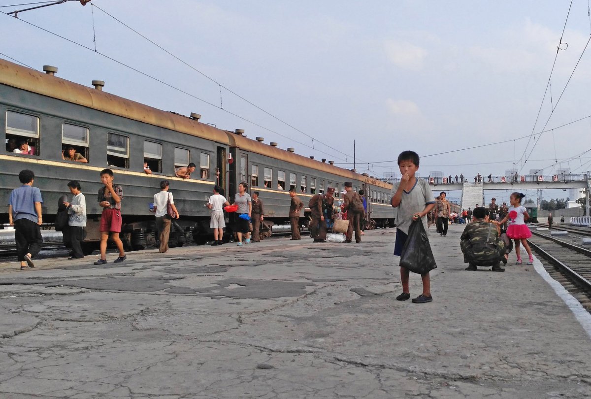 anytime-the-train-pulled-into-a-station-there-were-painful-reminders-of-the-countrys-poor-living-conditions-this-little-boy-begged-for-money-at-a-station-in-hamhung