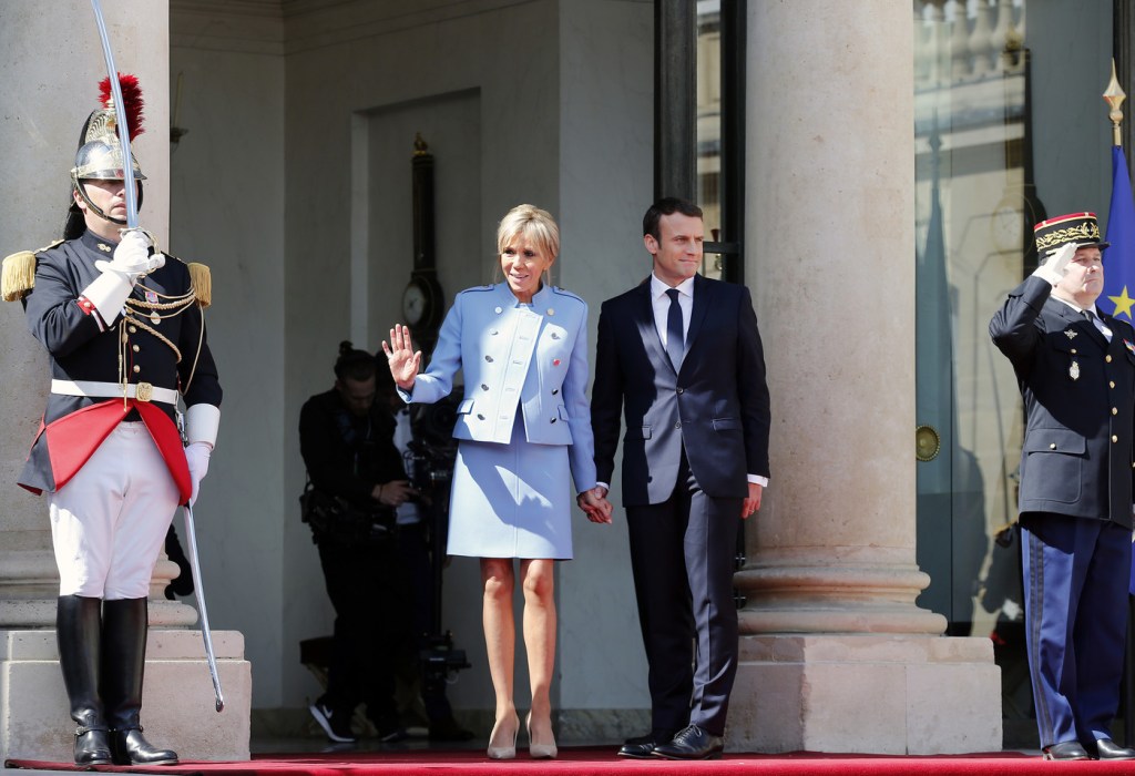 PARIS, FRANCE - MAY 14:  Newly-elected President Emmanuel Macron and his wife Brigitte Trogneux pose on the steps of the Elysee Palace after the handover ceremony with France's outgoing President Francois Hollande on May 14, 2017 in Paris, France. Macron was elected President of the French Republic on May 07, 2017 with 66,1 % of the votes cast.  (Photo by Thierry Chesnot/Getty Images)