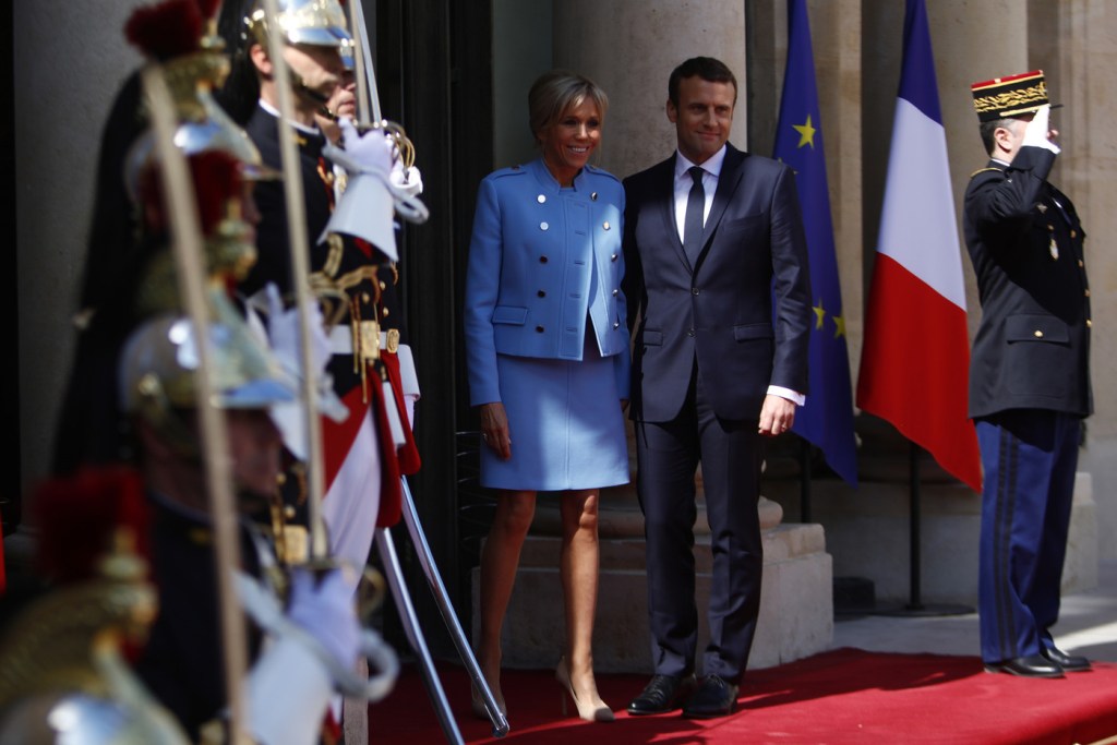 Newly-elected President Emmanuel Macron and his wife Brigitte Trogneux pose on the steps of the Elysee Palace after the handover ceremony with France's outgoing President Francois Hollande on May 14, 2017 in Paris, France. Macron was elected President of the French Republic on May 07, 2017 with 66,1 % of the votes cast.  (Photo by Mehdi Taamallah/NurPhoto via Getty Images)