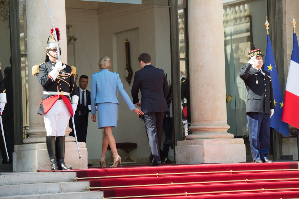 PARIS, FRANCE - MAY 14:  French newly elected President Emmanuel Macron with his Wife Brigitte Macron enter at the Elysee presidential Palace after the handover ceremony with his predecessor Francois Hollande at Elysee Palace on May 14, 2017 in Paris, France. Emmanuel Macron was elected President of the French Republic on May 07, 2017 with 66,1 % of the votes cast.  (Photo by Stephane Cardinale - Corbis/Corbis via Getty Images)