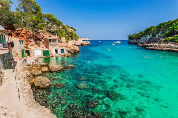 Summer holiday at the beach of Cala Llombards on Mallorca, Balearic islands.